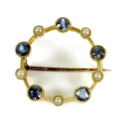 117 - A 15ct gold, sapphire and pearl brooch, of opal circle design with five beaded rubover set cornflowe... 