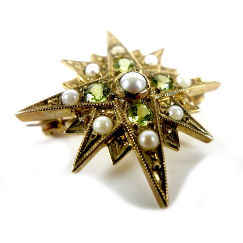 88 - A 9ct gold starburst brooch set with peridot and pearls, 3.1cm diameter, 4.0g.