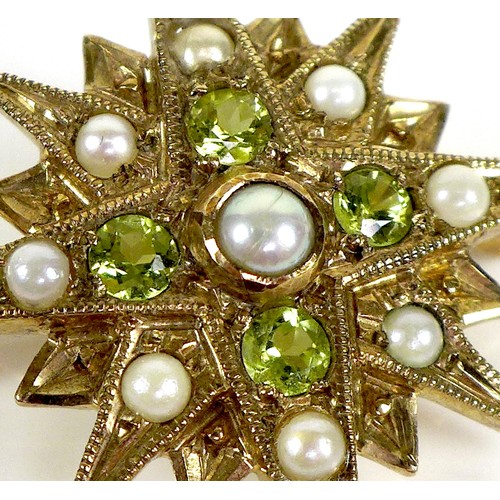 88 - A 9ct gold starburst brooch set with peridot and pearls, 3.1cm diameter, 4.0g.