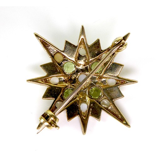 88 - A 9ct gold starburst brooch set with peridot and pearls, 3.1cm diameter, 4.0g.