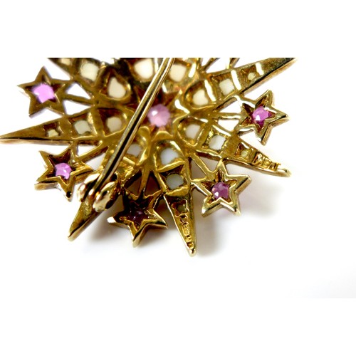 112 - A 9ct gold, ruby and pearl starburst brooch, 3.1cm diameter, 5.4g.