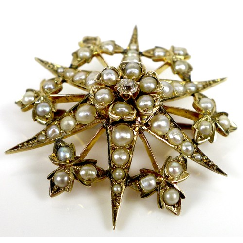 92 - A 9ct gold, pearl and diamond starburst brooch, a/f one pearl missing, 3.4cm diameter, 5.3g.