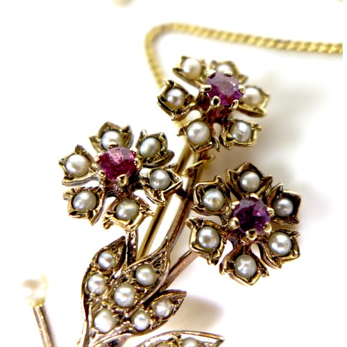 93 - A 9ct gold, pearl and ruby flower brooch, with safety chain, 5.3cm, 5.5g.