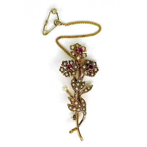 93 - A 9ct gold, pearl and ruby flower brooch, with safety chain, 5.3cm, 5.5g.