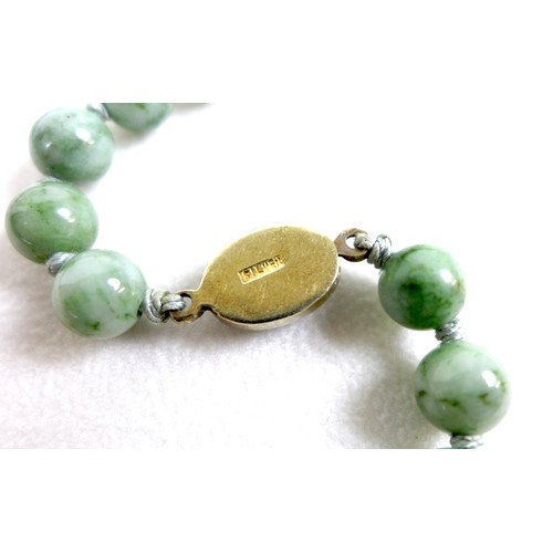 102 - Two vintage necklaces, comprising a jade bead necklace, of eighty eight beads, each 8.2mm diameter, ... 