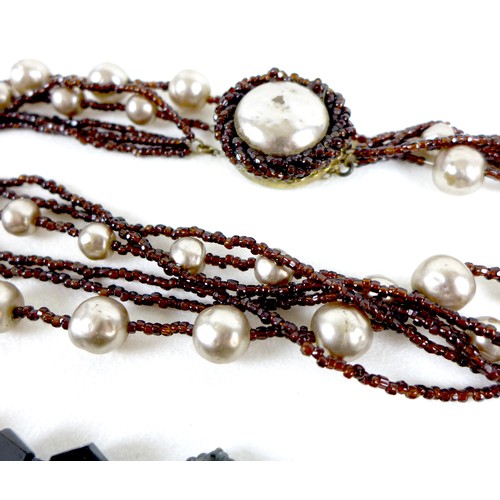 95 - A group of vintage Miriam Haskell jewellery, comprising a faux pearl and orange bead multi strand ne... 