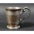 A Victorian silver tankard, with gently flared beaded rim above an engraved geometric scroll frieze,... 