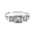 A diamond and platinum three stone ring, central princess cut stone, approximately 4 by 3mm, 0.39ct,... 