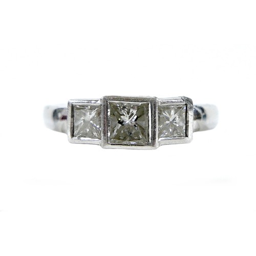 191 - A diamond and platinum three stone ring, central princess cut stone, approximately 4 by 3mm, 0.39ct,... 