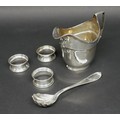 A group of five silver items, comprising a George III silver helmet shaped milk jug, with Victorian ... 