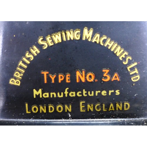 105 - A vintage BSM (British Sewing Machines Ltd) treadle powered Type 3a, housed within a walnut veneered... 