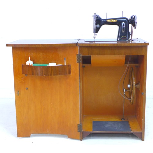 105 - A vintage BSM (British Sewing Machines Ltd) treadle powered Type 3a, housed within a walnut veneered... 