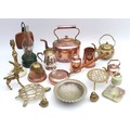 A collection of copper and metal wares, including a Victorian copper kettle, brass trivets, warming ... 