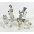 A group of four Lladro figurines, comprising 'Angel Laying Down', 01004541, 7.5cm high,  'Angel', 01... 
