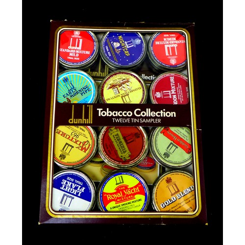 113 - A collection of vintage tobacco pipes and smoking ephemera, including three silver mounted pipes, a ... 