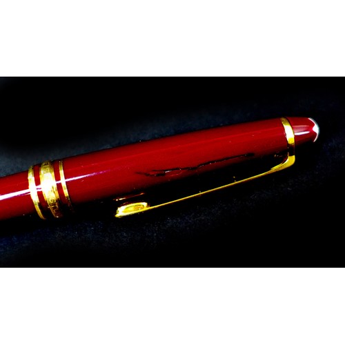 114 - A Mont Blanc Meisterstuck fountain pen in burgundy, with 14ct gold nib numbered '4810', a/f, togethe... 