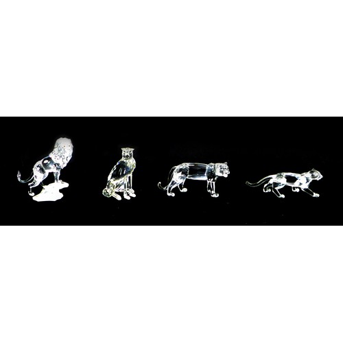 94 - Four Swarovski crystal ornaments, comprising a lion A7610 NR 000 004, 12cm high, a lioness A7610 NR ... 