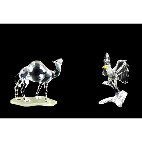 86 - Two Swarovski crystal ornaments, comprising an Eagle A7670 NR 000 002, 12.5cm high, and a camel A760... 