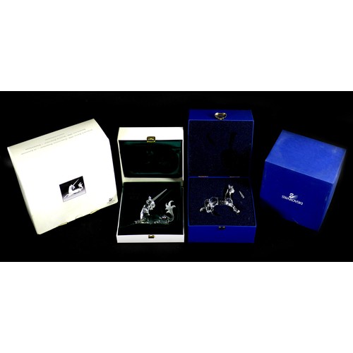 88 - Two Swarovski crystal ornaments, comprising a 1996 annual edition pf a seated Unicorn,  together wit... 