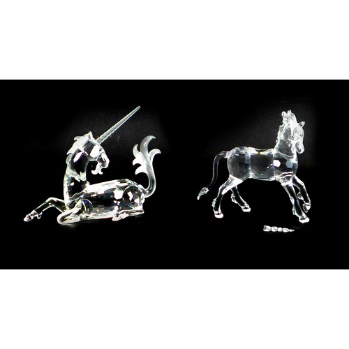 88 - Two Swarovski crystal ornaments, comprising a 1996 annual edition pf a seated Unicorn,  together wit... 