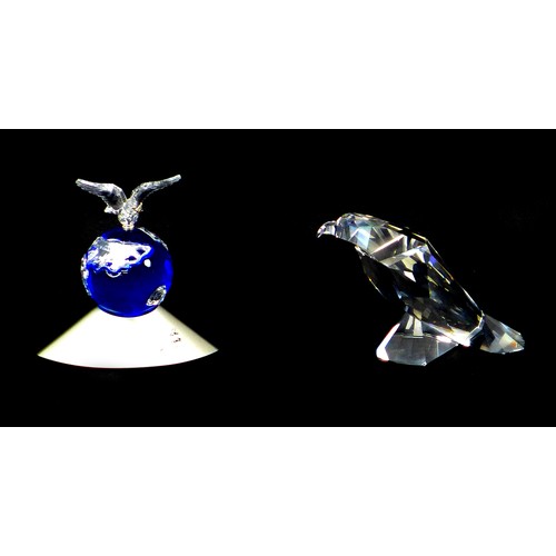 89 - Two Swarovski crystal ornaments, comprising a Crystal Planet Vision 2000 collectors' piece, A7607 NR... 