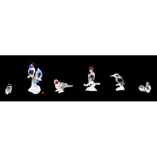 79 - Six Swarovski crystal ornaments, comprising a cockatoo A7621 NR 000 007, 8cm high, a Kingfisher A763... 