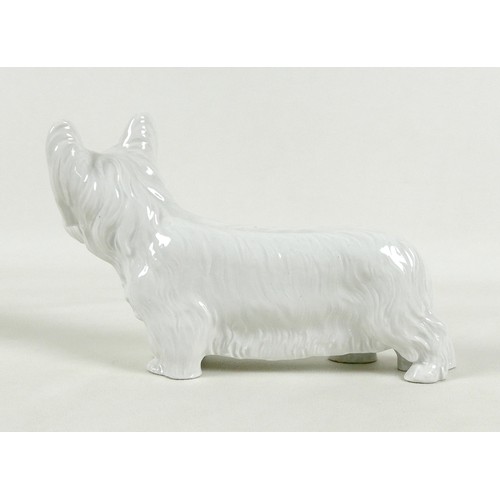 63 - A Meissen blanc de chine porcelain figurine, modelled as a 'Skye Terrier', circa 1940, model number ... 