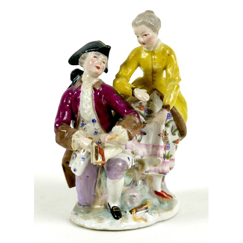 60 - A Continental 19th century porcelain figure group, in the style of Dresden, modelled as a gentleman ... 