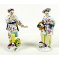 A pair of Meissen porcelain figures, early 19th century, modelled as fruit sellers, model numbers 65... 
