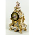 A French porcelain mantel clock, mid 19th century, of Rococo design with a cherub surmount, decorate... 