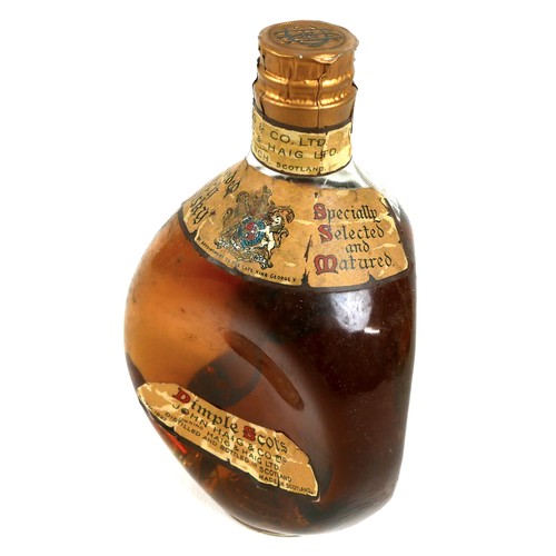 104 - A bottle of Haig's 'Dimple' old blended Scotch whisky, circa 1940, label inscribed 'By Appointment T... 