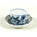 A Meissen porcelain cup and saucer, early to mid 19th century, with scalloped rim, the cup with moul... 