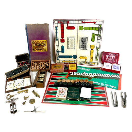 107 - A group of vintage games and collectables, including a Victorian brass whist marker made by Perry & ... 