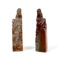 A pair of Chinese soapstone carvings, early 20th century, a modelled as a mirrored pair of old men, ... 