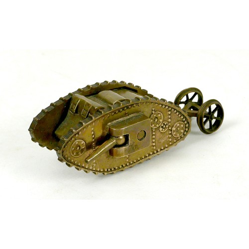 116 - A WWI trench art brass Mk 1 tank, with two side guns, and rear steering wheels, 13 by 4.8 by 4.2cm h... 