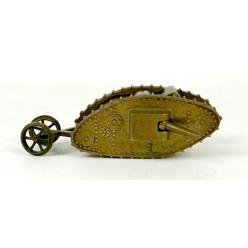 116 - A WWI trench art brass Mk 1 tank, with two side guns, and rear steering wheels, 13 by 4.8 by 4.2cm h... 