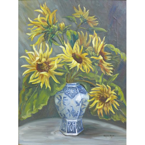 84 - A 20th century still life of sunflowers in a blue and white vase, oil on canvas, signed 'Erica Eske'... 