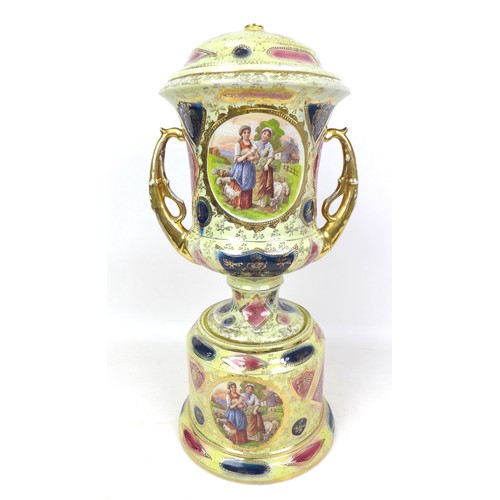 25 - A group of 20th century ceramic items, comprising a Royal Vienna twin handled urn, with stand and co... 
