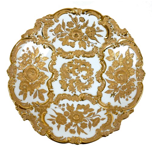 44 - A Meissen porcelain dish, circa 1900, decorated with moulded relief flowers and C-scrolls in Rococo ... 