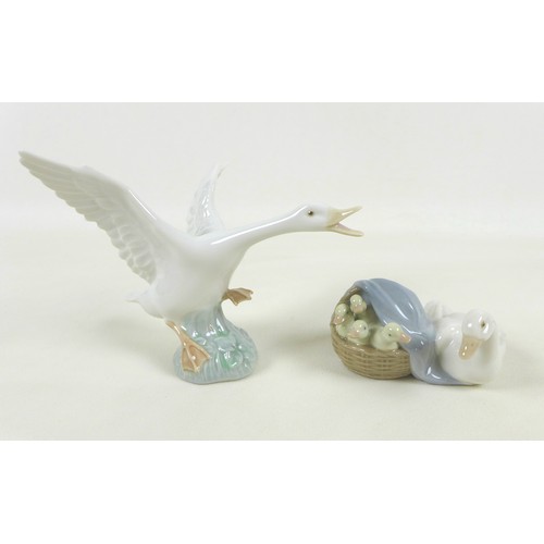 30 - A collection of Lladro figurines, including 'Girl with Duck', SKU 01001052, 25cm high, a sitting nun... 