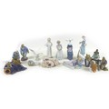 A collection of Lladro figurines, including 'Girl with Duck', SKU 01001052, 25cm high, a sitting nun... 