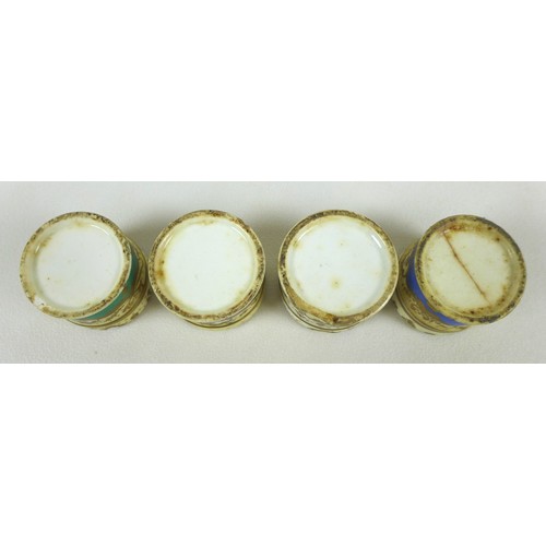 27 - A group of four early 19th century porcelain paste pots and covers, each of cylindrical form, each d... 