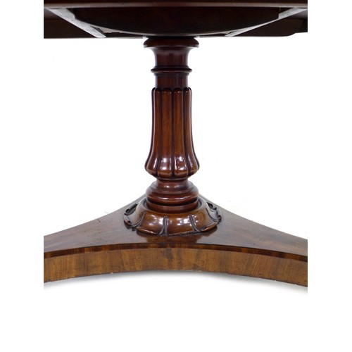 233 - A 19th century mahogany circular top breakfast table, with tilt top mechanism, with fluted column tr... 