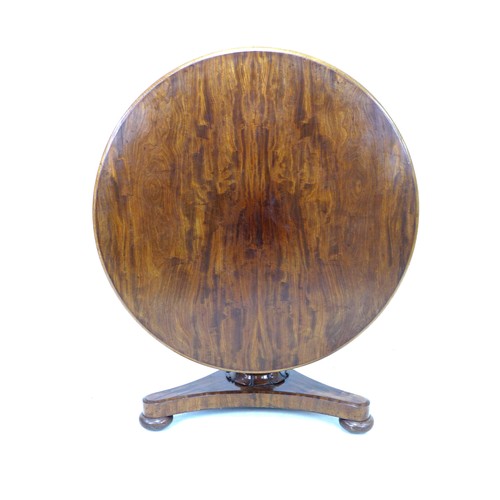 233 - A 19th century mahogany circular top breakfast table, with tilt top mechanism, with fluted column tr... 