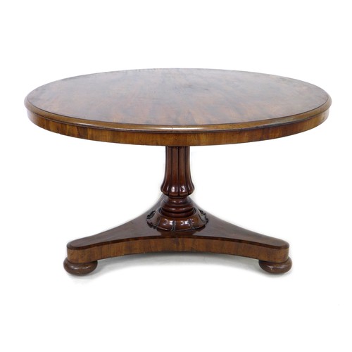 233 - A 19th century mahogany circular top breakfast table, with tilt top mechanism, with fluted column tr... 