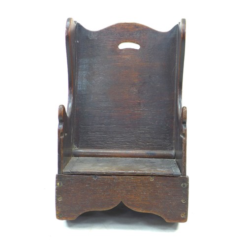 236 - An early 18th century oak child’s potty chair, with wing back and lift seat, 37.5 by 42 by 60cm high... 