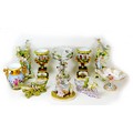 Ten 19th century style porcelain centrepieces and spill vases, including a Dresden style centrepiece... 