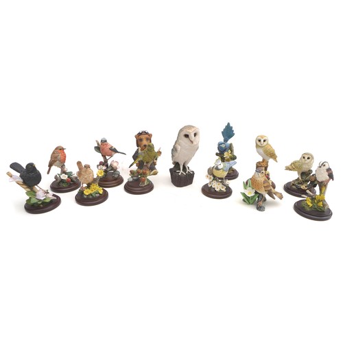51 - A group of Country Artists resin sculptures, all modelled as different birds, together with a simila... 