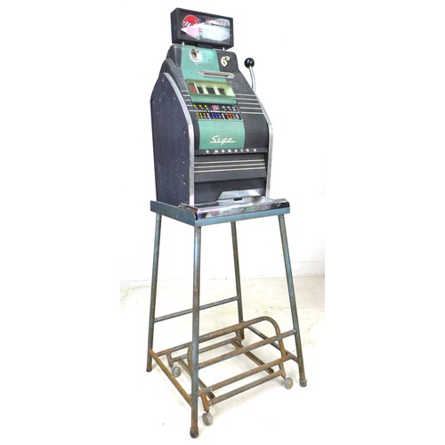 57 - A vintage Sega Monaco one-armed-bandit, slot machine, with stand and assorted tokens, without key an... 