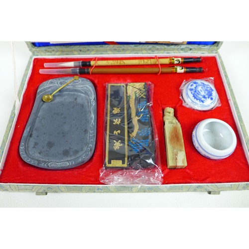 66 - A collection of 20th century Chinese collectables, including a cased Mahjong game, a boxed group of ... 